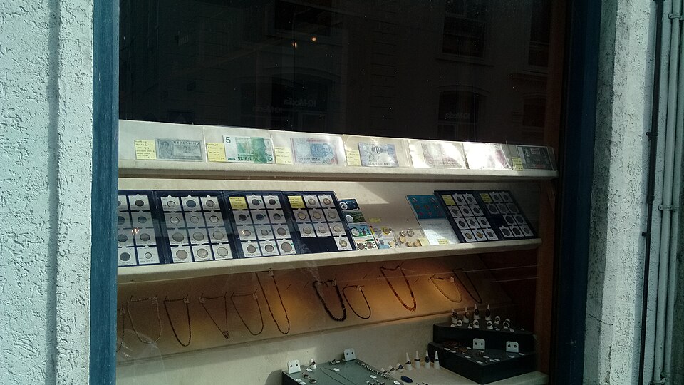 Interior of a Houston precious metals coin shop showing gold and silver display cases