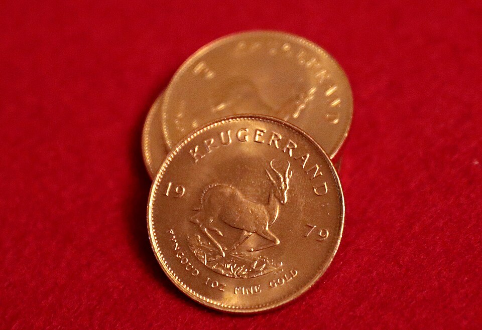 Verifying Gold Krugerrand weight on a precision scale for authenticity